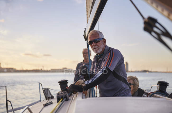 Portrait confident man sailing sailboat — Stock Photo