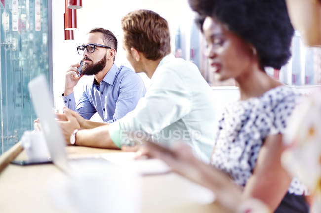 Business people at modern cafe counter — Stock Photo