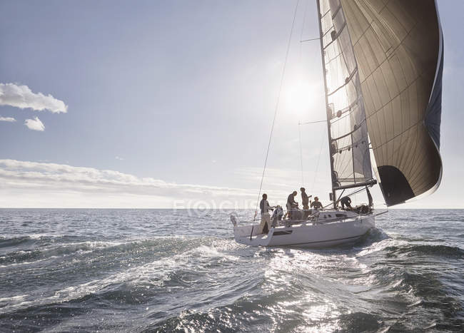 Scenic view of sailboat on sunny ocean — Stock Photo