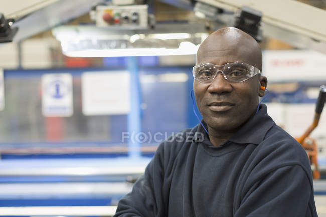 Portrait confident worker in steel factory — Stock Photo