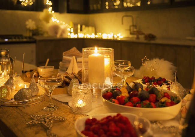 Scenic view of candlelight Christmas table with decorations — Stock Photo