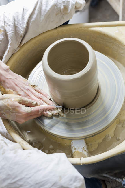 Overhead view woman using pottery wheel — Stock Photo