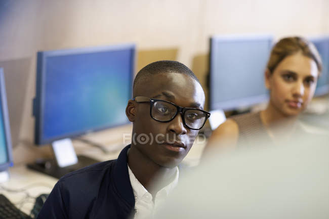 University student with raised eyebrow during seminar in classroom — Stock Photo