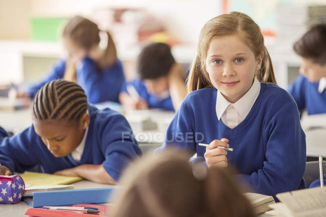 Elementary school children in classroom during lesson — Stock Photo
