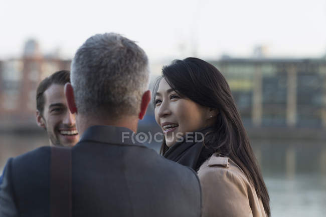Adult business people talking outdoors — Stock Photo