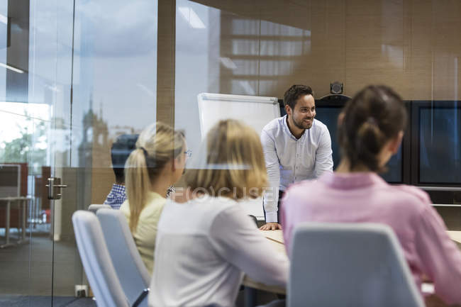 Businessman leading meeting in conference room — Stock Photo