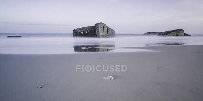 Ruins in tranquil ocean at low tide, Vigsoe, Denmark — Stock Photo