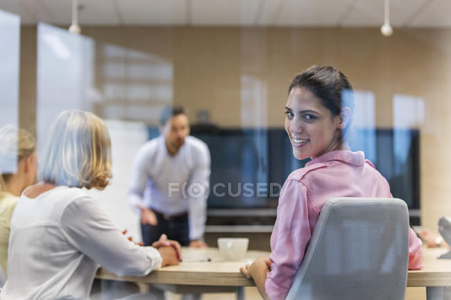 Portrait smiling businesswoman in conference room meeting — Stock Photo