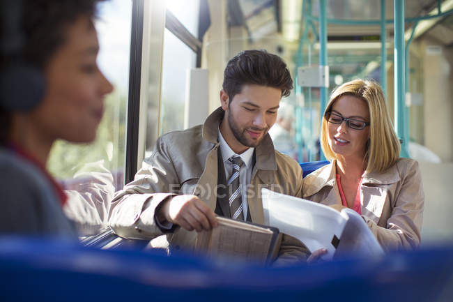 Business people talking on train — Stock Photo