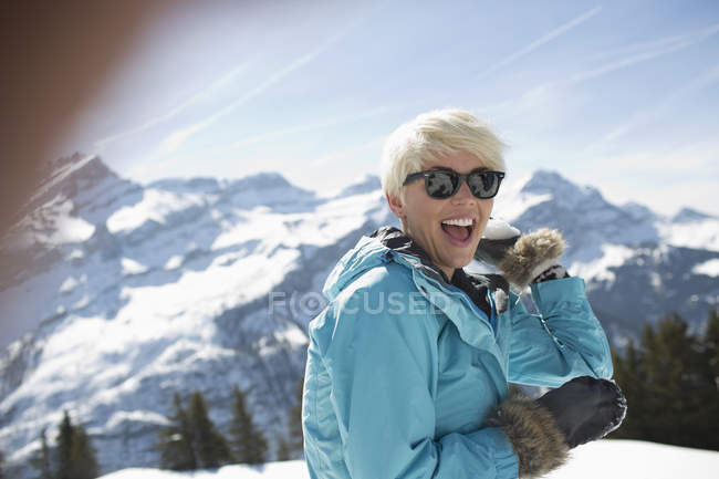 Portrait of laughing woman in snow — Stock Photo