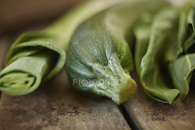 Still life close up fresh, organic, healthy green leek, zucchini and kale — Stock Photo