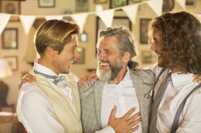 Best man, bridegroom and father in domestic room — Stock Photo