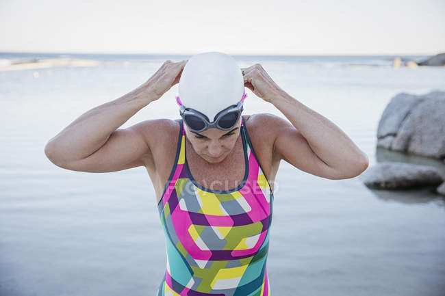Female swimmer at ocean on background  outdoors — Stock Photo