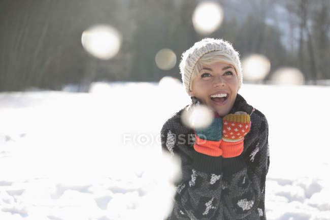 Woman laughing in snow — Stock Photo
