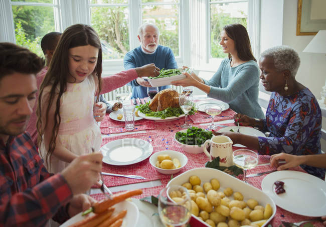 Multi-generation family eating at Christmas dinner table — Stock Photo