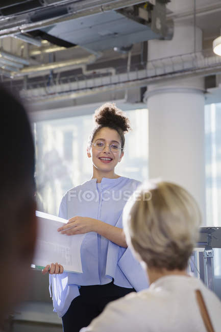 Young businesswoman leading conference presentation — Stock Photo