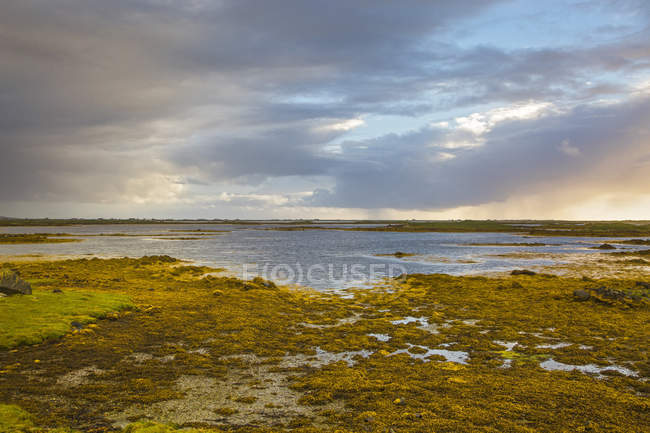 Tranquil scene clouds over lake, Loch Euphoirt, North Uist, Outer Hebrides — Stock Photo