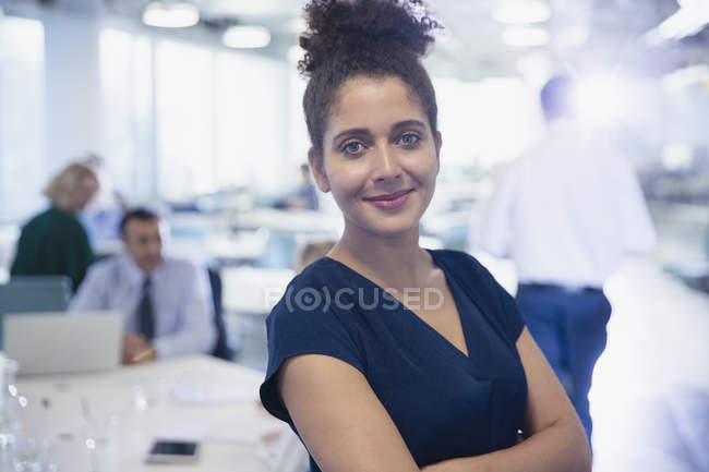 Portrait confident businesswoman in modern office — Stock Photo