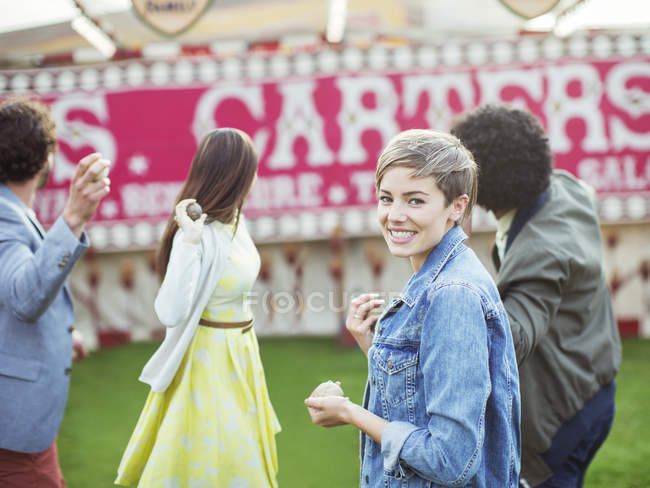 Group of friends playing game in amusement park — Stock Photo
