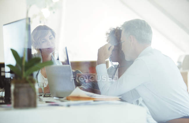 Office workers planning at desk in modern office — Stock Photo