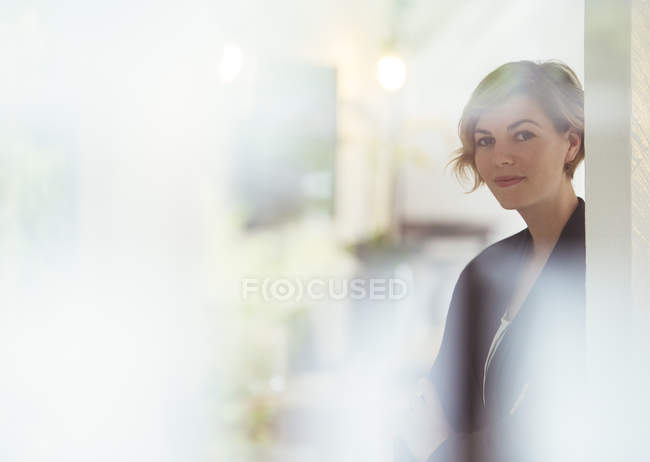Portrait of young woman at modern office — Stock Photo