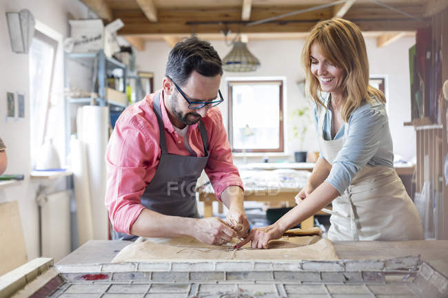 Stained glass artists working in studio — Stock Photo