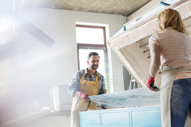 Artists placing stained glass in studio kiln — Stock Photo