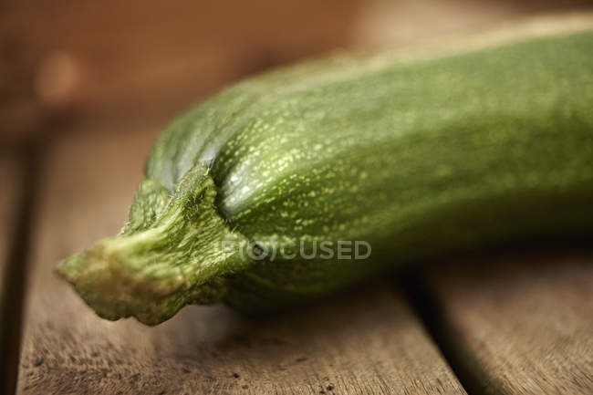 Still life close up fresh, organic, healthy green zucchini on wood — Stock Photo