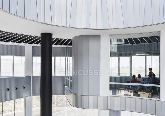 Business people meeting in architectural, modern conference room window — Stock Photo