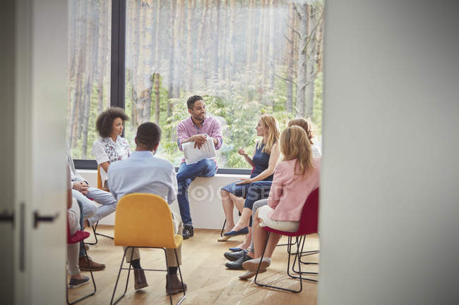 Woman talking in group therapy session — Stock Photo