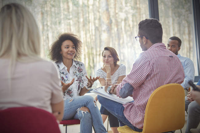 Woman talking in group therapy session — Stock Photo