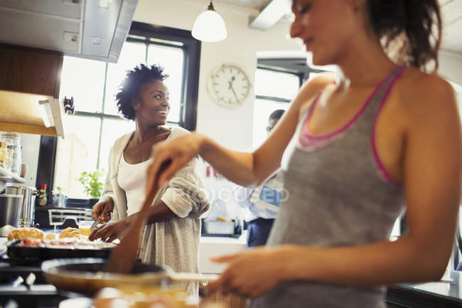 Women cooking in kitchen — Stock Photo