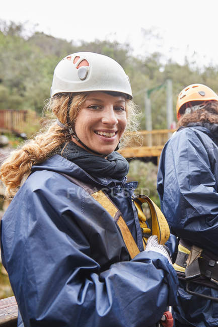 Portrait smiling, confident woman preparing to zip line — Stock Photo