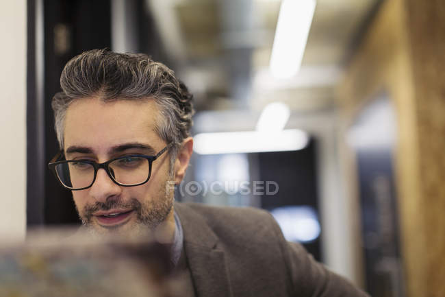 Businessman working in office indoors — Stock Photo