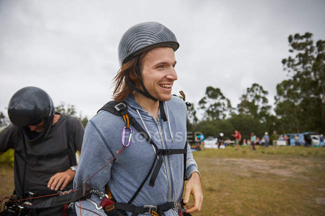 Smiling male paraglider smiling and looking away — Stock Photo