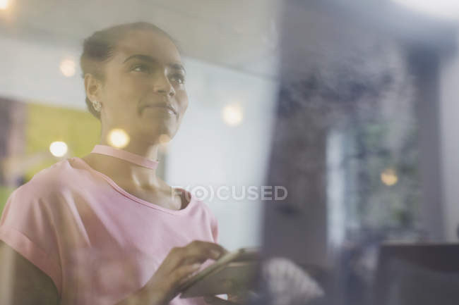 Ambitious businesswoman using digital tablet — Stock Photo