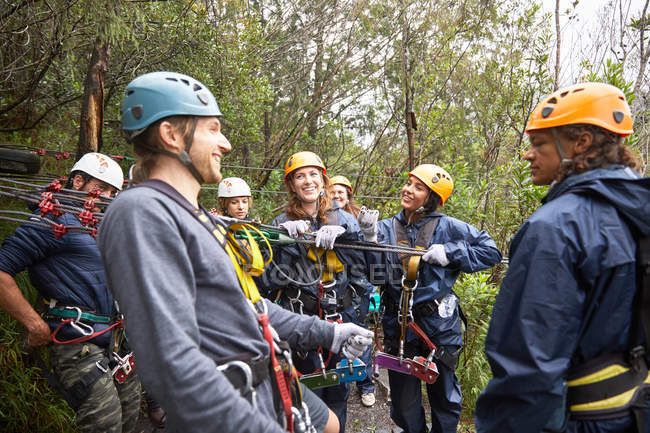 Happy group of friends preparing to zip lining — Stock Photo