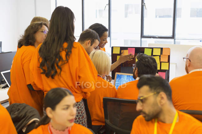 Hackers coding for charity at hackathon — Stock Photo