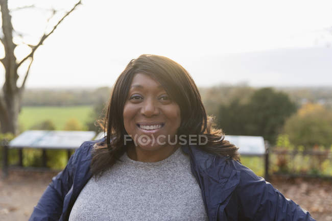 Portrait smiling, confident woman in park — Stock Photo