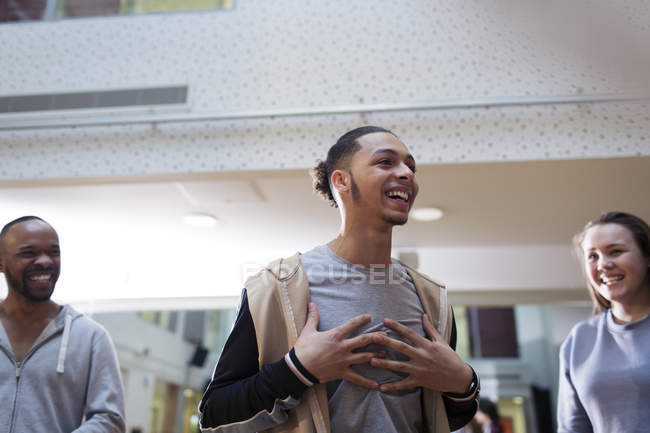 Laughing, enthusiastic teenage boy in dance class studio — Stock Photo