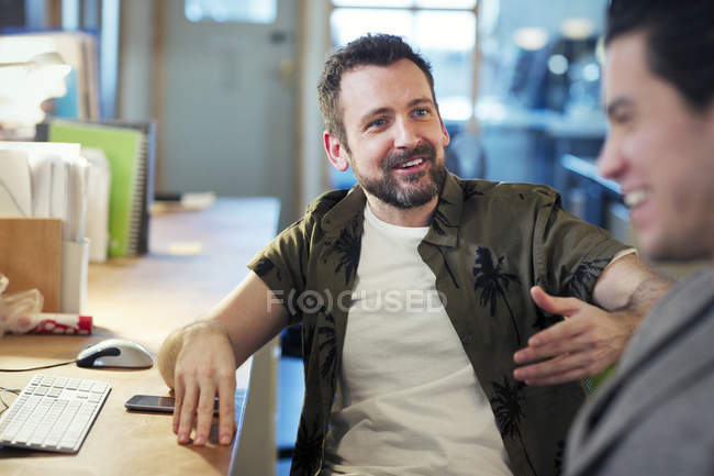 Creative businessmen talking, meeting in office — Stock Photo