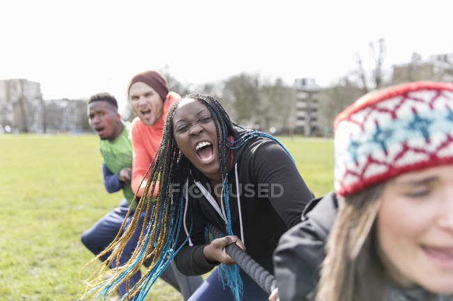Determined team pulling rope in tug-of-war — Stock Photo
