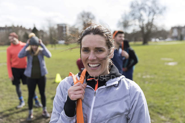 Portrait smiling, confident woman exercising in park — Stock Photo