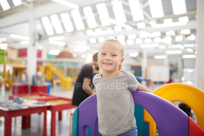 Portrait cute girl playing in science center — Stock Photo