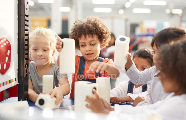 Kids playing with large dice in science center — Stock Photo