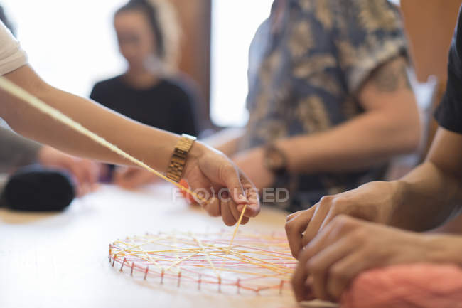 People doing string art project — Stock Photo