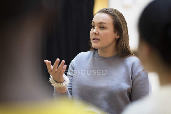 Focused teenager girl leading discussion — Stock Photo