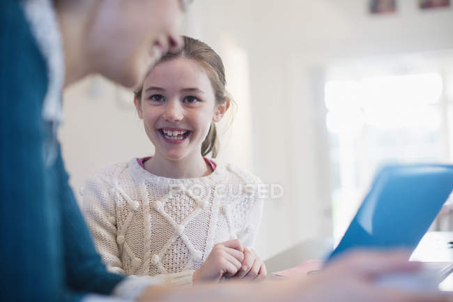Happy mother and daughter using laptop — Stock Photo