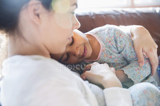 Affectionate, tender mother and daughter cuddling — Stock Photo