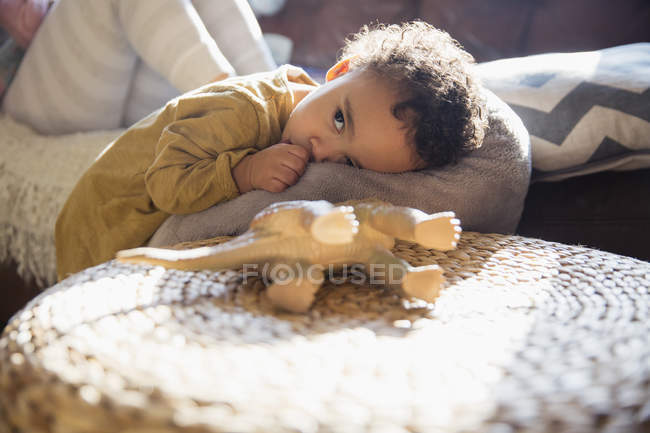 Tired, cute baby boy sucking thumb — Stock Photo